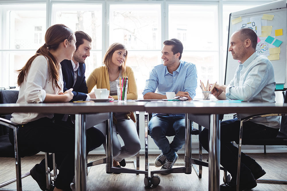 A group of business colleagues collaborating around a table.